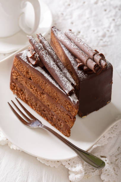 istock Exquisite French truffle cake with chocolate chips close up. vertical 996692646