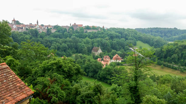 looking at the medieval city of rothenburg ob der tauber in the distance. - altmühltal imagens e fotografias de stock