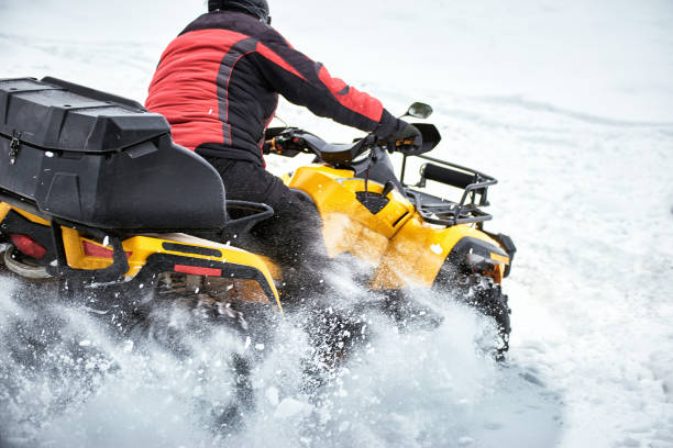 istock Winter race on an ATV on snow in the forest. 996710124