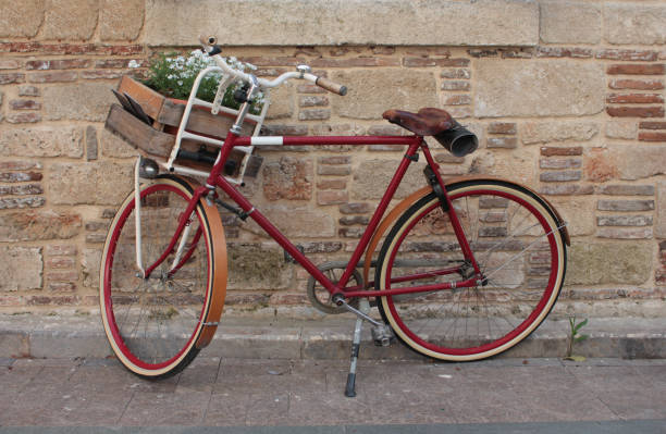 istock Red bicycle standing in front of the wall 996717844
