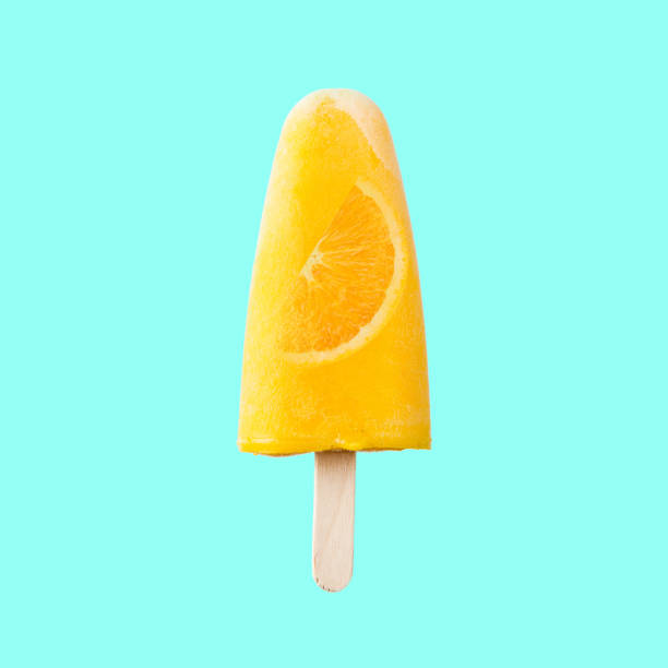 istock Tasty and refreshing orange popsicles on blue background. 996727662