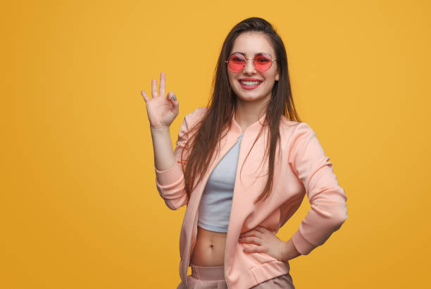 istock Stylish woman gesturing OK 996730492