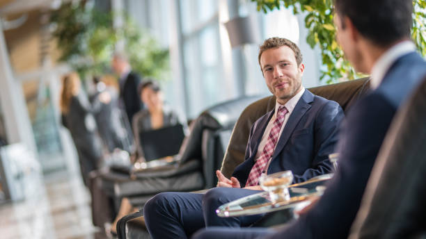 istock Businessmen sitting on chair at airport 996734412