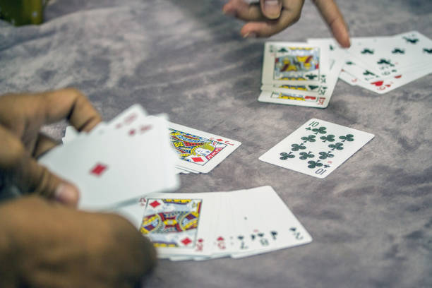 istock Retired people playing card in a retirement home 996734782