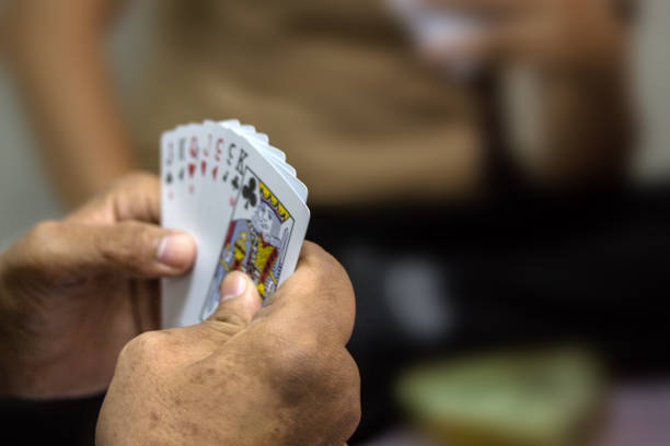 istock Retired people playing card in a retirement home 996734910