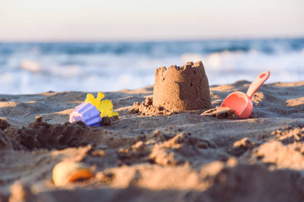 istock Sand castle on Mediterranean beach. Summer vacation concept background 996738954
