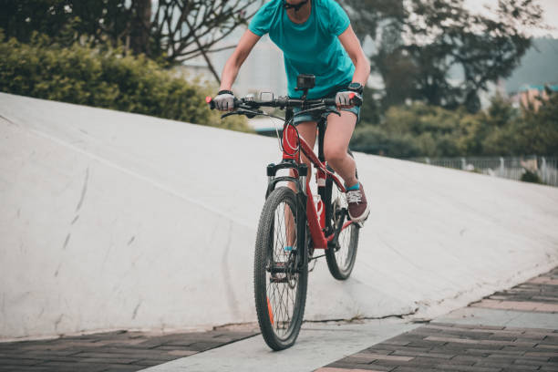 istock Woman freerider riding down ramps 996747010