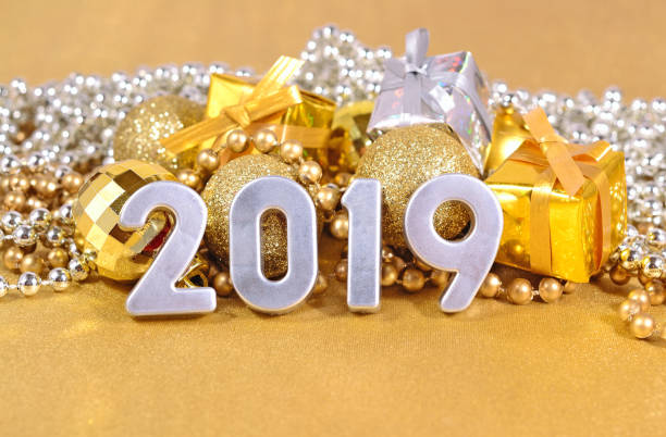 istock 2019 year silver figures and Christmas decorations 996749764