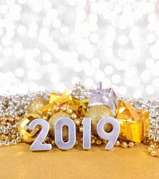 istock 2019 year silver figures on the background of Christmas decorations 996749940