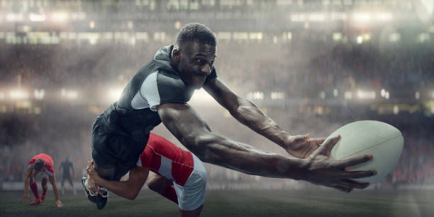 joueur de rugby abordés dans les airs sur le point de marquer essai - muscular build action human muscle black and white photos et images de collection