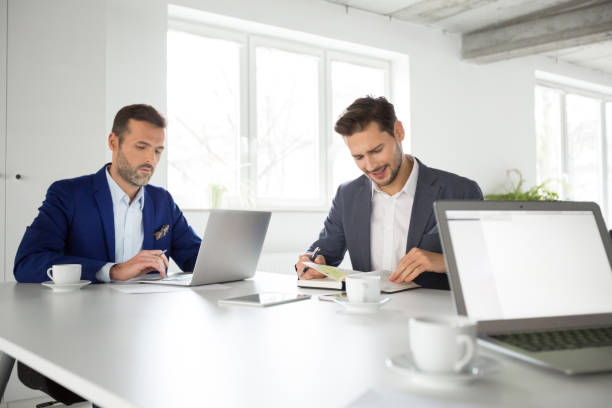 istock Business partners working together in office 996757576