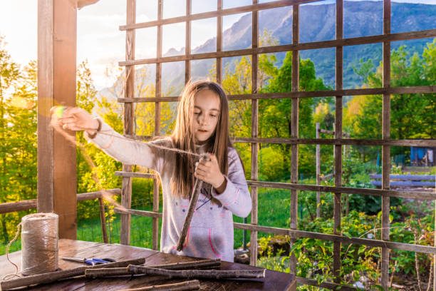 istock Girl Building Wooden Raft 996762238