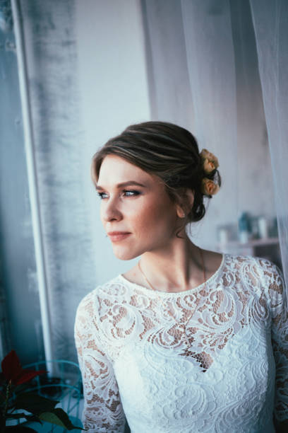 istock portrait of a bride near a window studio 996764818