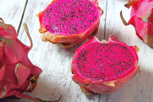 istock Dragon fruits on wooden background. 996765146