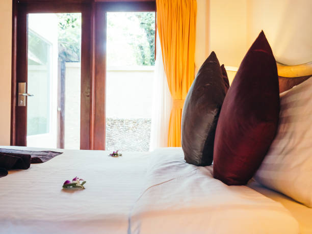 istock Comfortable pillow on bed decoration in hotel bedroom 996766542