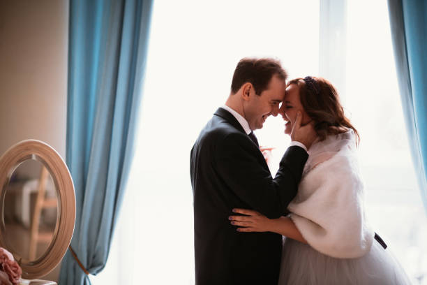 istock young bride and groom couple in a bright studio photo 996768894