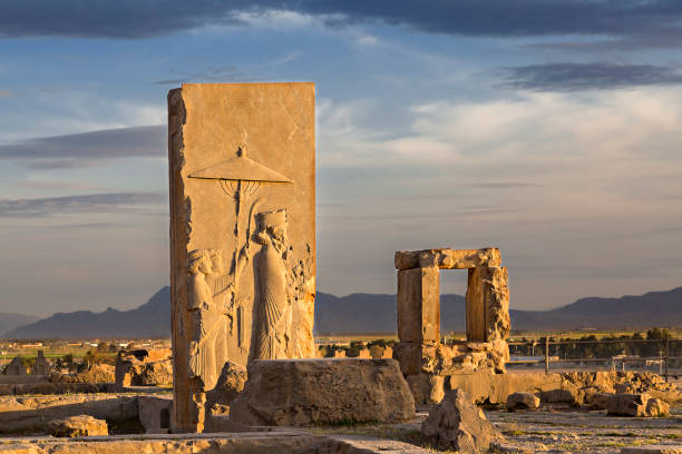 Persian reliefs at the sunset, in the remains of the old city of Persepolis, in Iran. Remains of Persian city of Persepolis in Iran. shiraz stock pictures, royalty-free photos & images