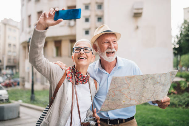 istock Elderly couple smiling and taking a selfie 996773962