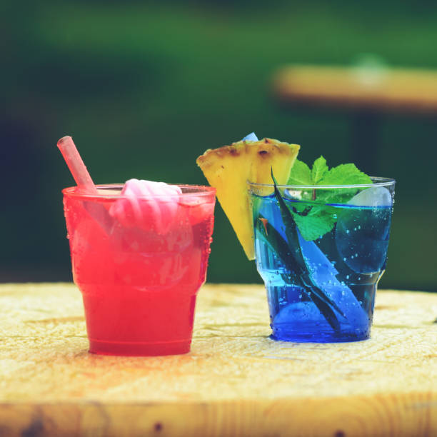 selective focus on cold fresh cocktails in glasses with straw on