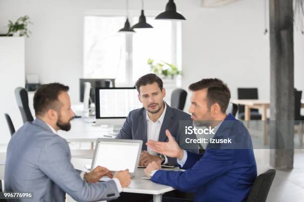 Business Team Brainstorming Over New Strategy In Meeting Stock Photo - Download Image Now