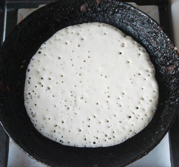 istock Raw pancake on a frying pan 996787884