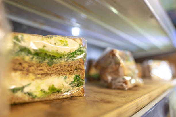 Egg and cress sandwich on a shelf in plastic wrap