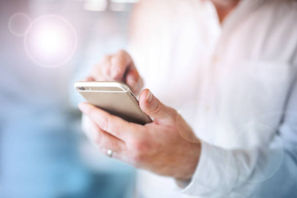 istock Man with mobile phone in his hands 996793568