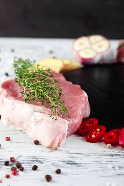 istock Raw pork meat with spice ingredient 996797052