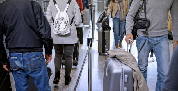 istock Business people walking in queue at airport 996797664