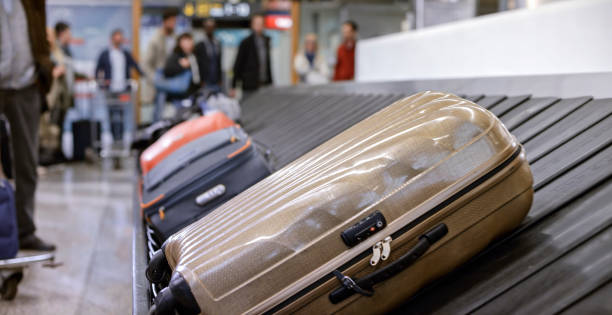 Business people standing at baggage claim