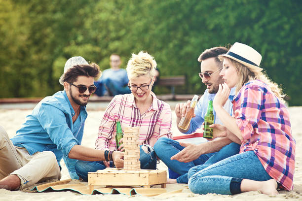 istock Friends enjoying beach 996800386