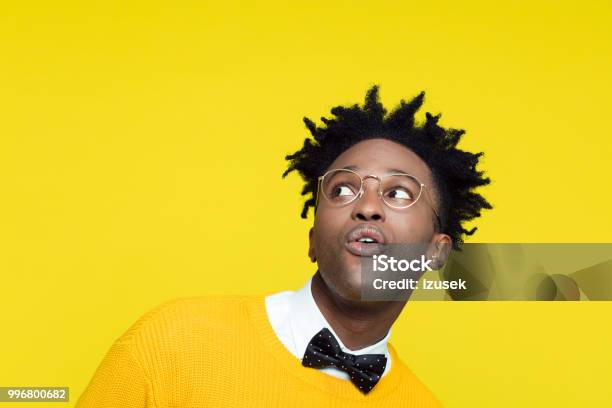 Funny Portrait Of Surprised Nerdy Young Man Looking Up Stock Photo - Download Image Now