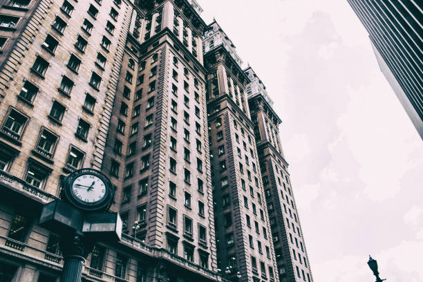 istock Clock in front of a vintage corporate building 996811460