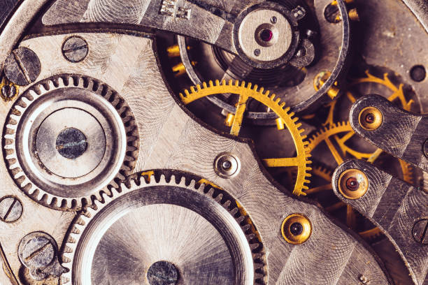 istock Clockwork Background. Old Clock Watch Mechanism. Retro Clockwork Watch Mechanism With Gray And Golden Gears. Vintage Movement Mechanics 996811938