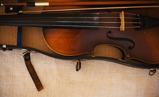 Details of an old and dusty violin from Czechoslovakia.