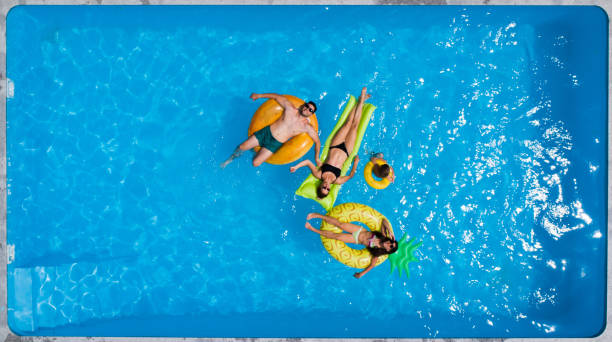 istock Family in the pool 996829190