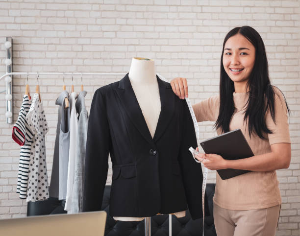 istock Designer women measuring suit at her work place 996832036
