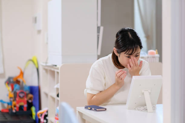 istock woman putting skin lotion on face 996835396