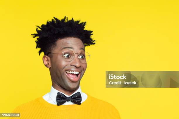 Funny Portrait Of Surprised Geeky Young Man Stock Photo - Download Image Now - Comedian, Humor, Eyeglasses