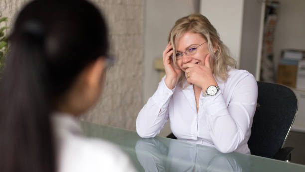 istock Candidate laughing during job interview in office 996843398