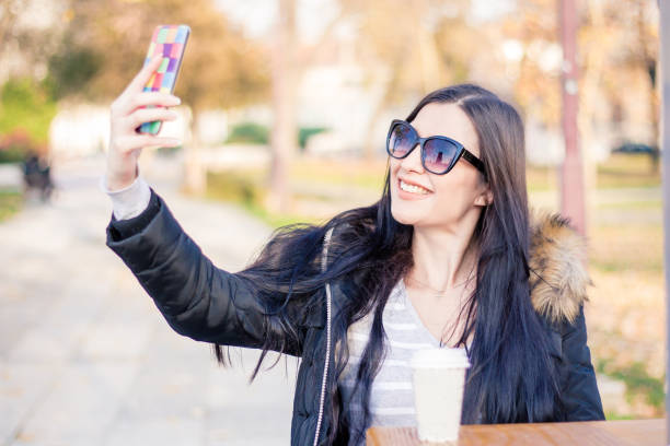 istock Beautiful woman taking selfie 996843646