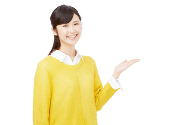 istock Asian woman pointing side 996844364