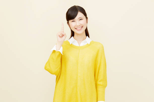 istock Asian woman pointing side 996846456