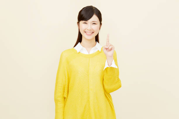 istock Asian woman pointing side 996846460
