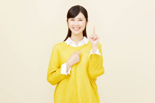 istock Asian woman pointing side 996846484