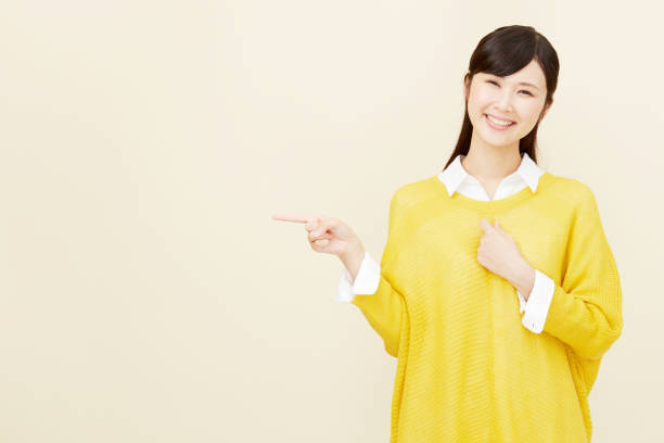 istock Asian woman pointing side 996846486