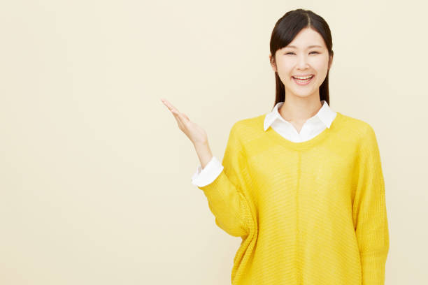 istock Asian woman pointing side 996846544