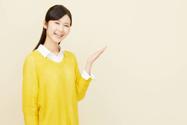 istock Asian woman pointing side 996846550