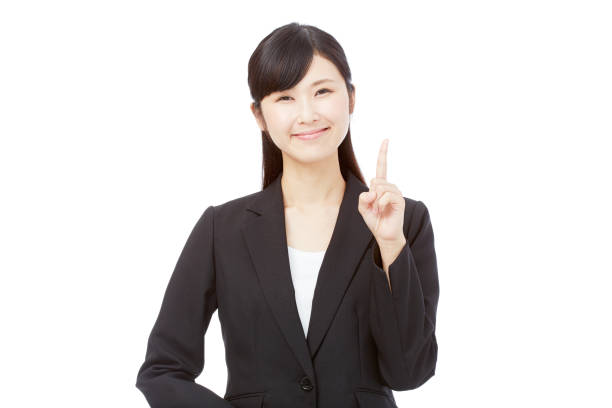 Asian woman pointing side stock photo