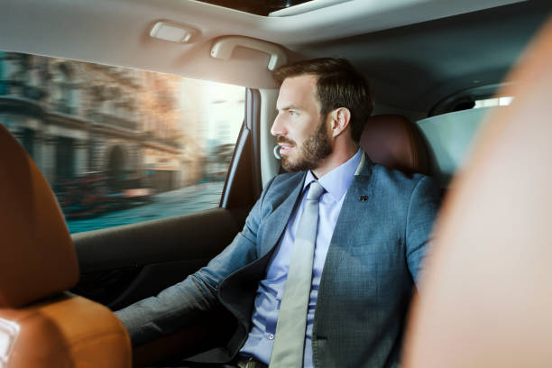 Businessman driving through city